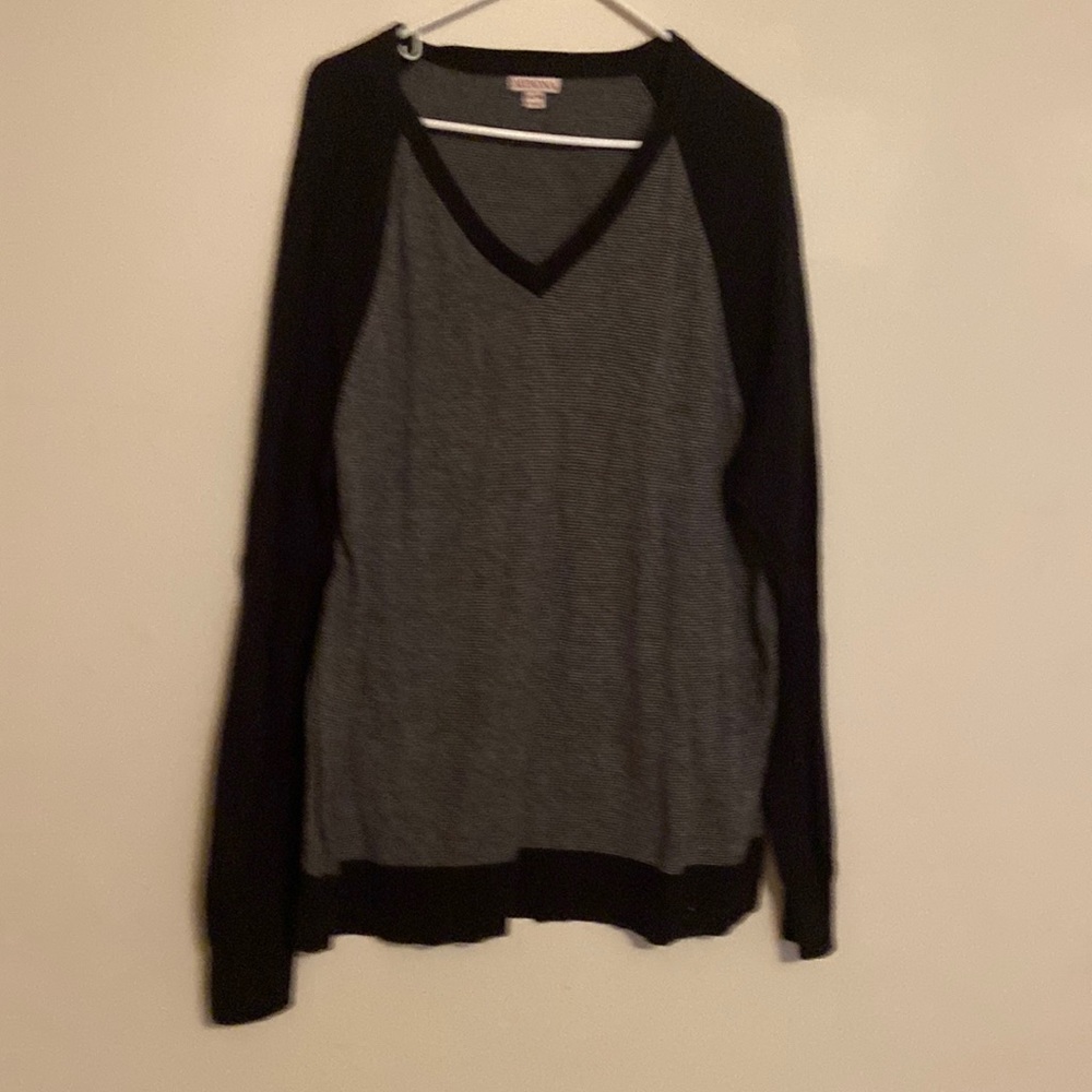 Long sleeve sweater is black and gray. The size is extra large.